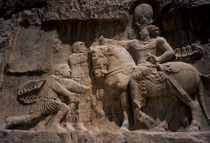 The depiction of Philip the Arab on Syria’s 100 pound note is an indicator of the deep historical ties between ancient Iran and Syria. In a rock carving at the Naqsh-e Rustam necropolis in southern Iran’s Fars Province, Philip the Arab is shown along with the Roman Emperor Valerian the Elder as they bow before the Persian king Shapur I the Great. ©1999 Derek Henry Flood